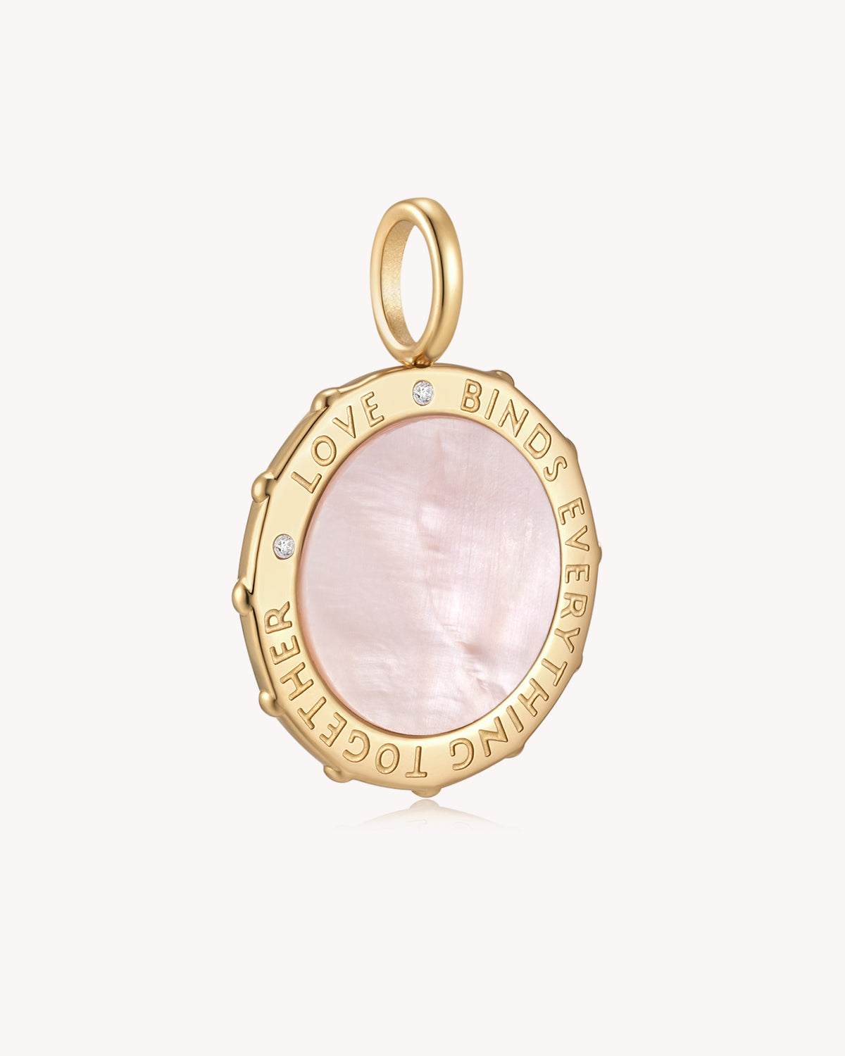 Angled view of Love Binds Everything Together Colossians 3:14 Gold Medallion