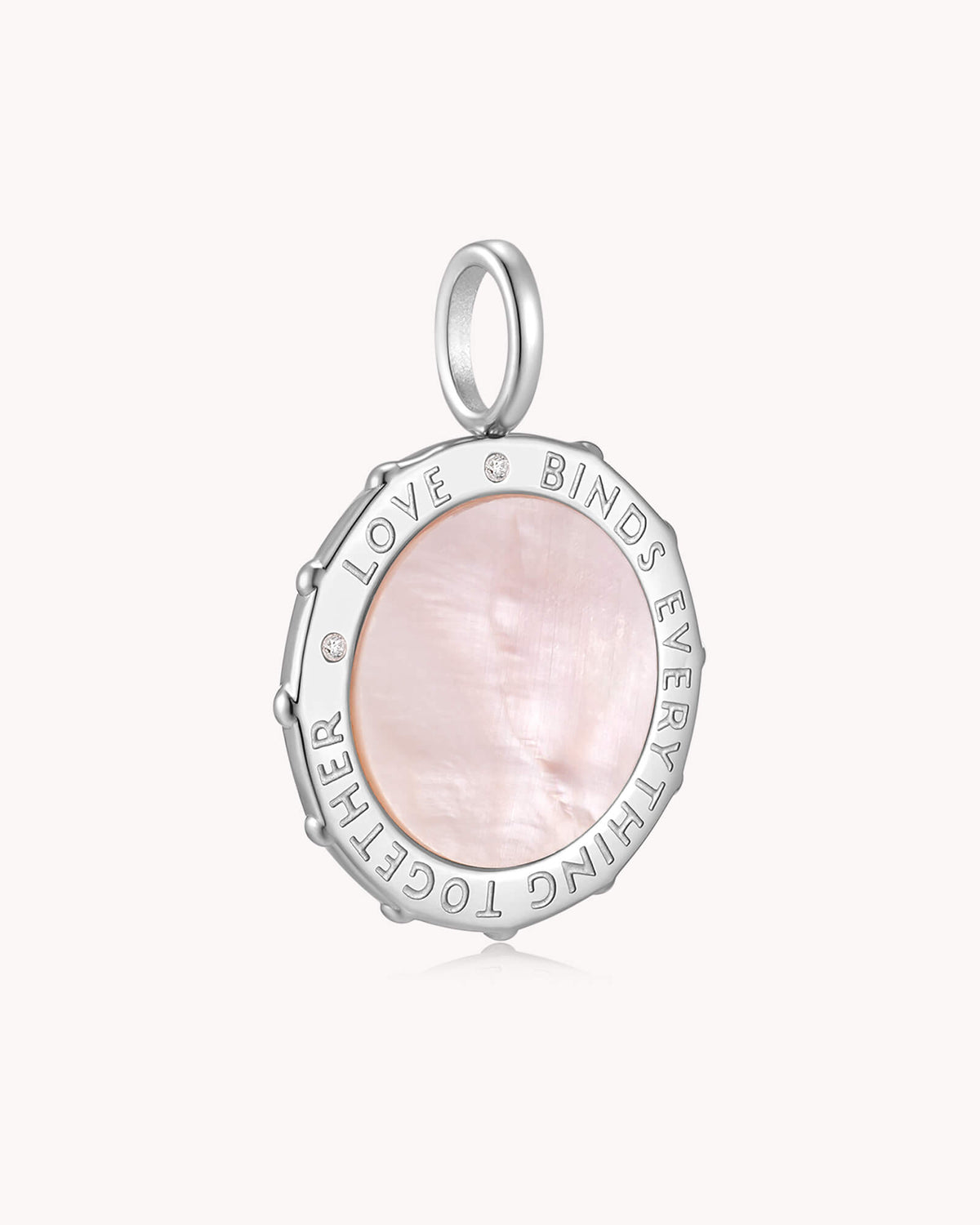 Angled view of Love Binds Everything Together Colossians 3:14 White Gold Medallion