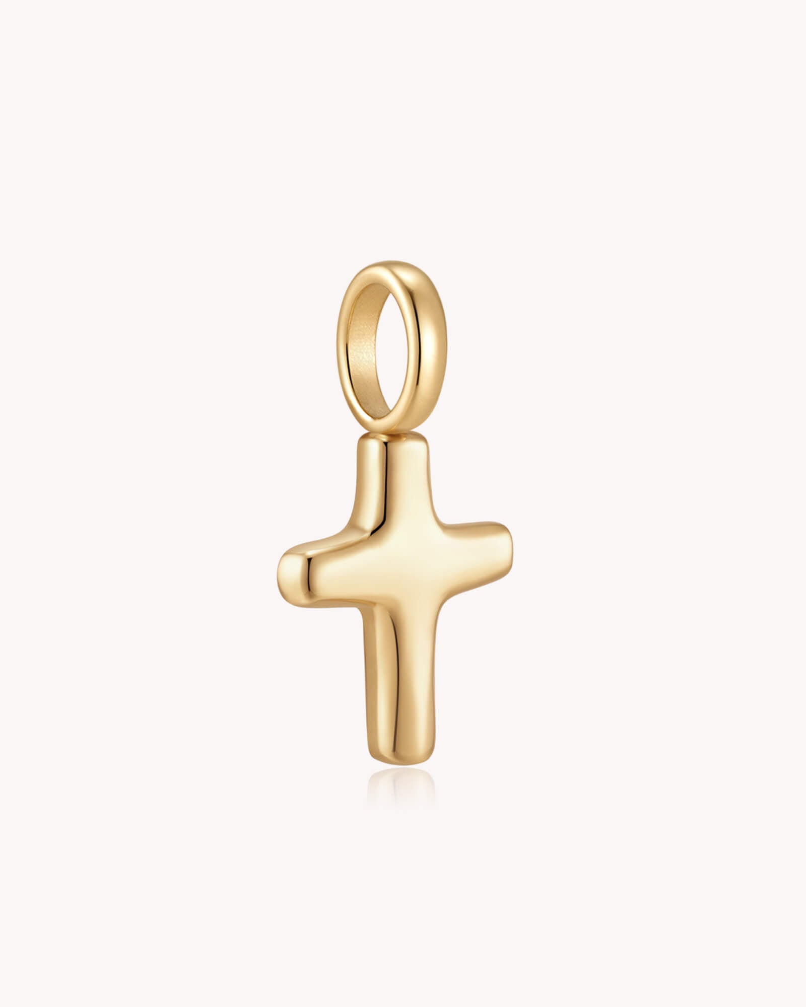 Angled view of Gold Petite Puff Cross Pendant