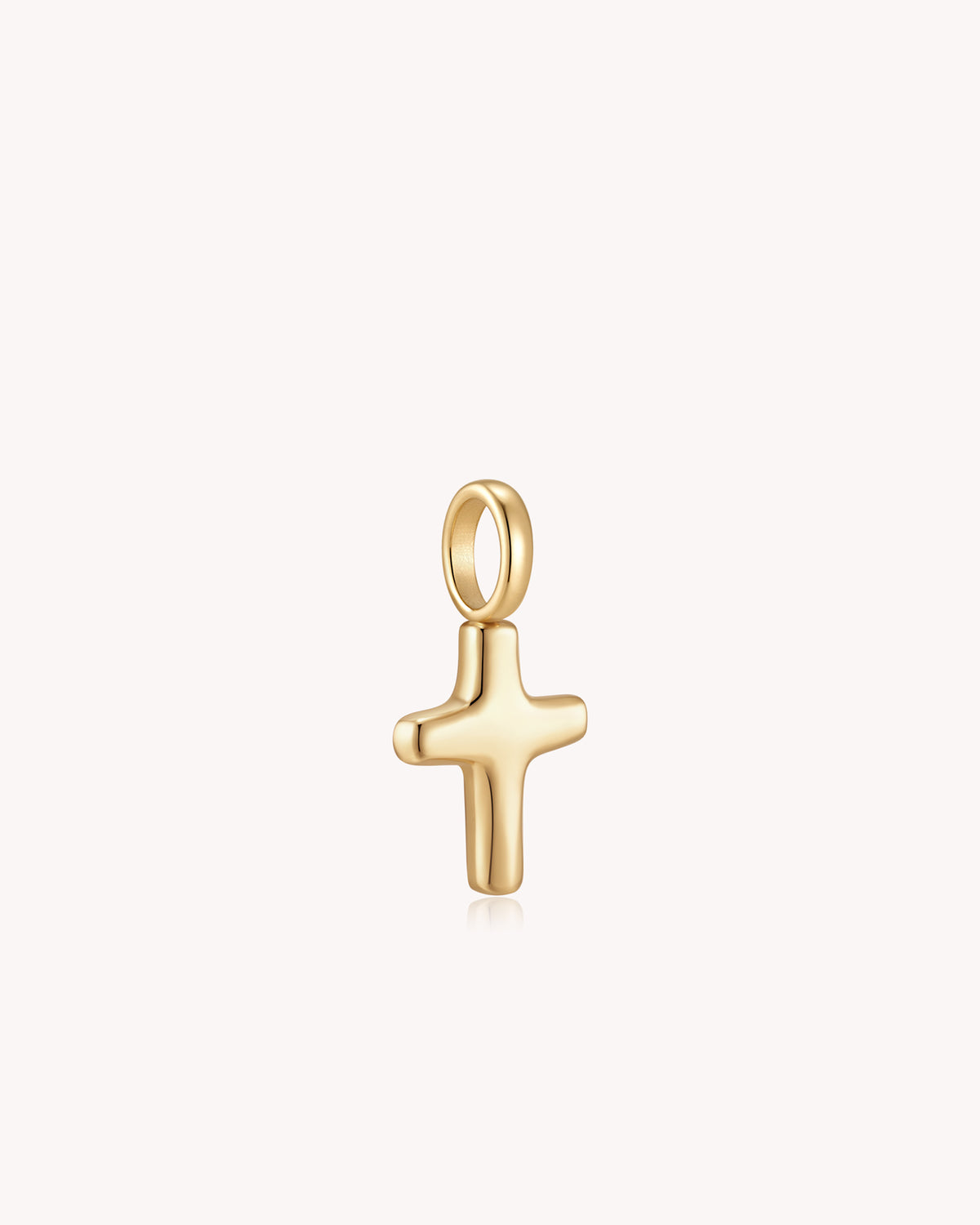 Angled view of Gold Petite Puff Cross Pendant
