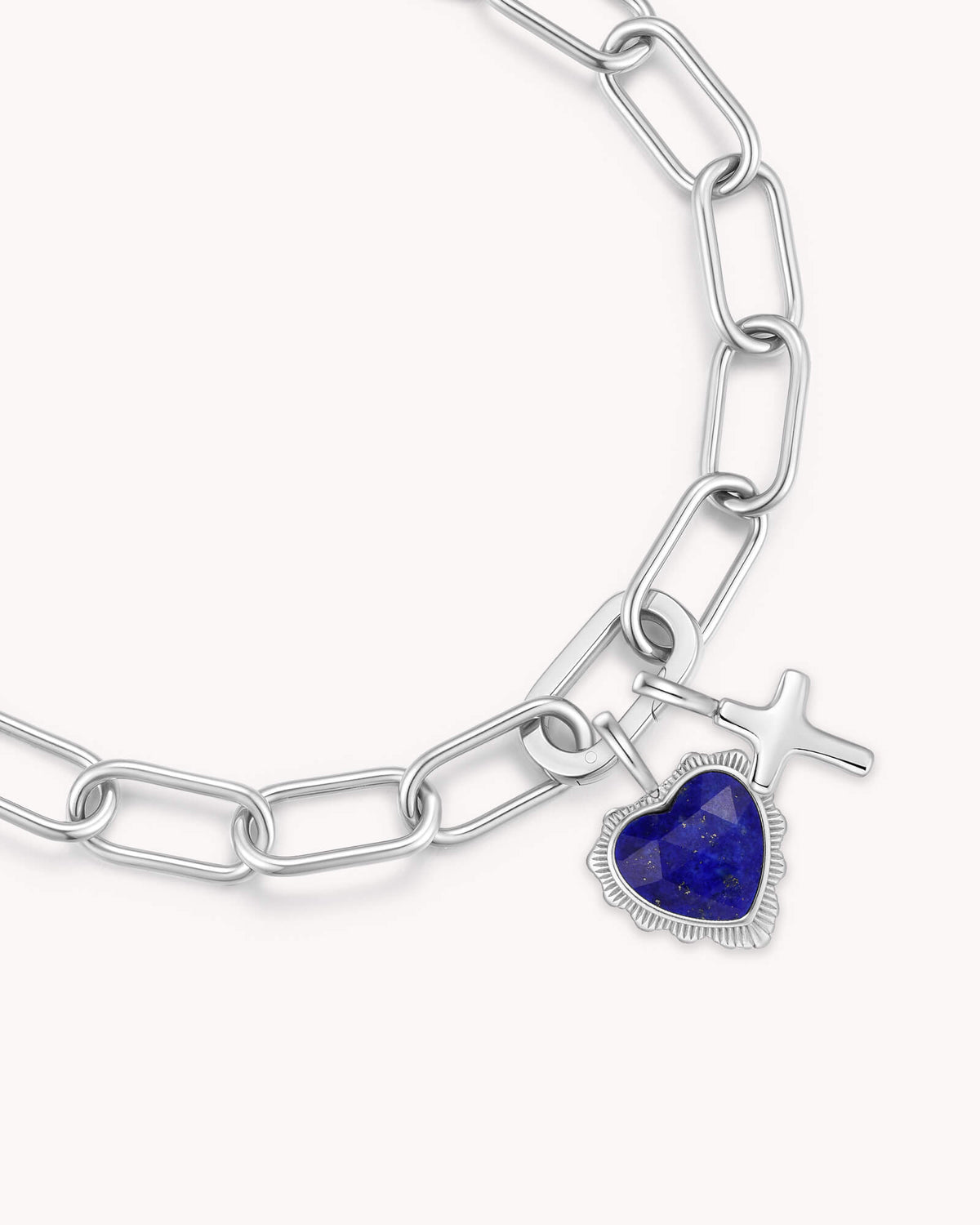 Close up of James 1:2 White Gold Heart Puff Cross Charm Bracelet