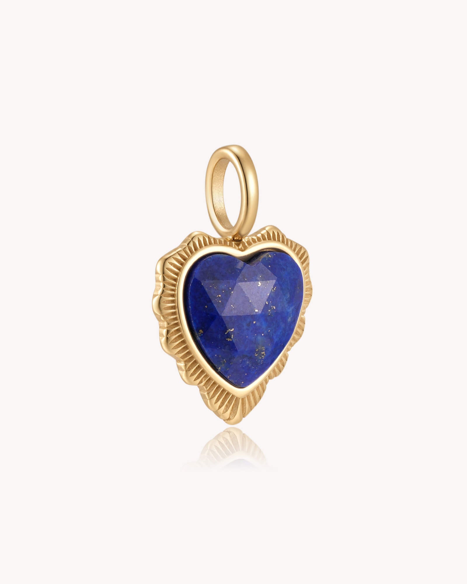Angled view of Count It All Joy James 1:2 Gold Lapis Lazuli Heart Pendant