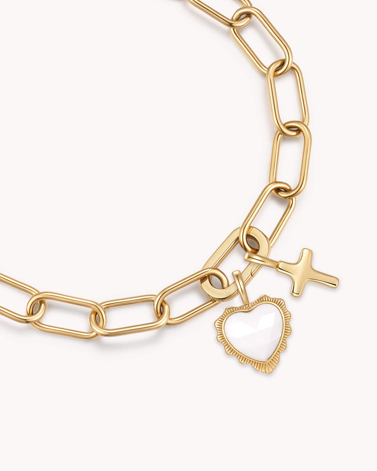 Close up of John 16:33 Take Heart Gold Heart Puff Cross Charm Bracelet