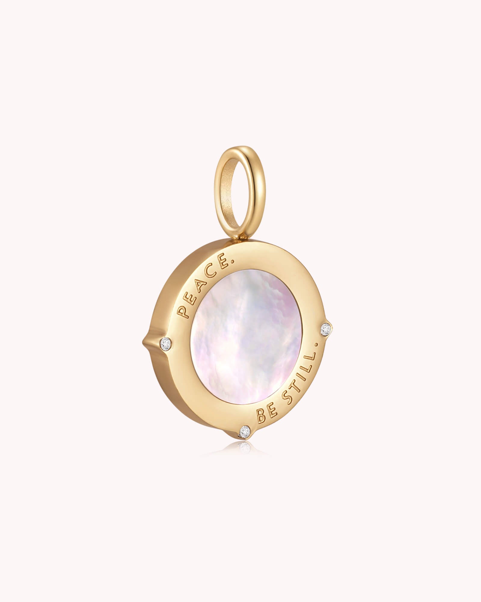 Angled view of Peace Be Still Mark 4:39 Gold Pendant