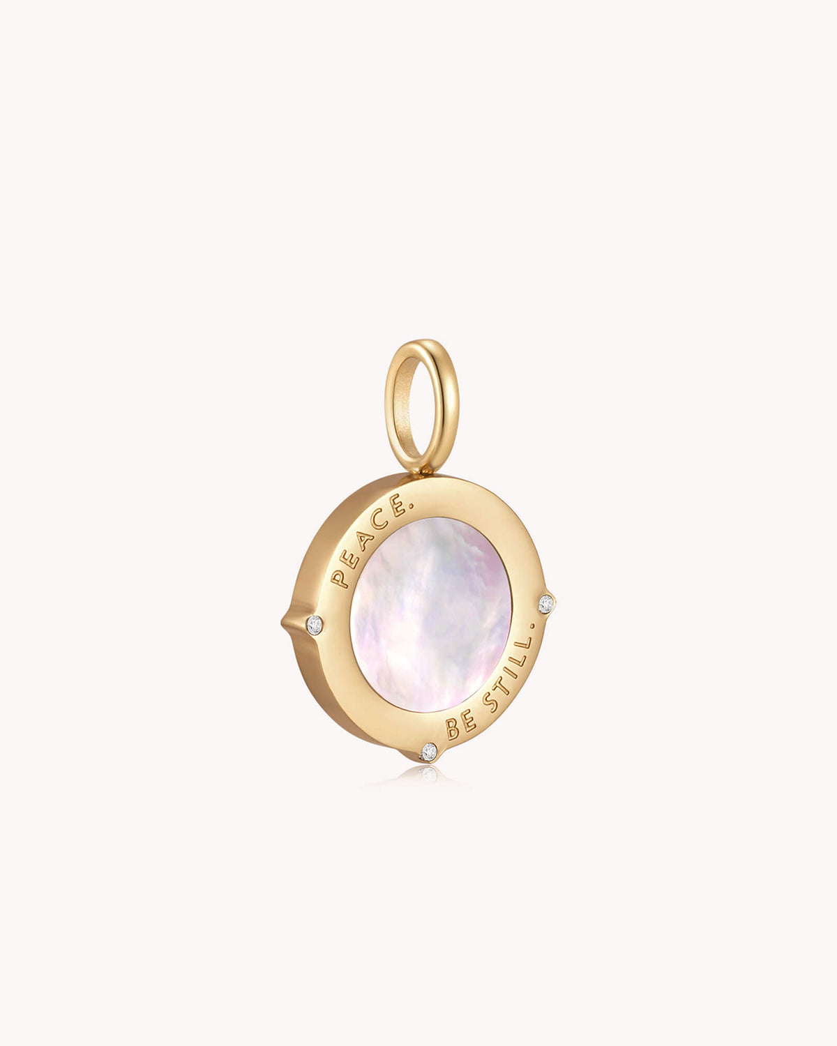 Angled view of Peace Be Still Mark 4:39 Gold Pendant