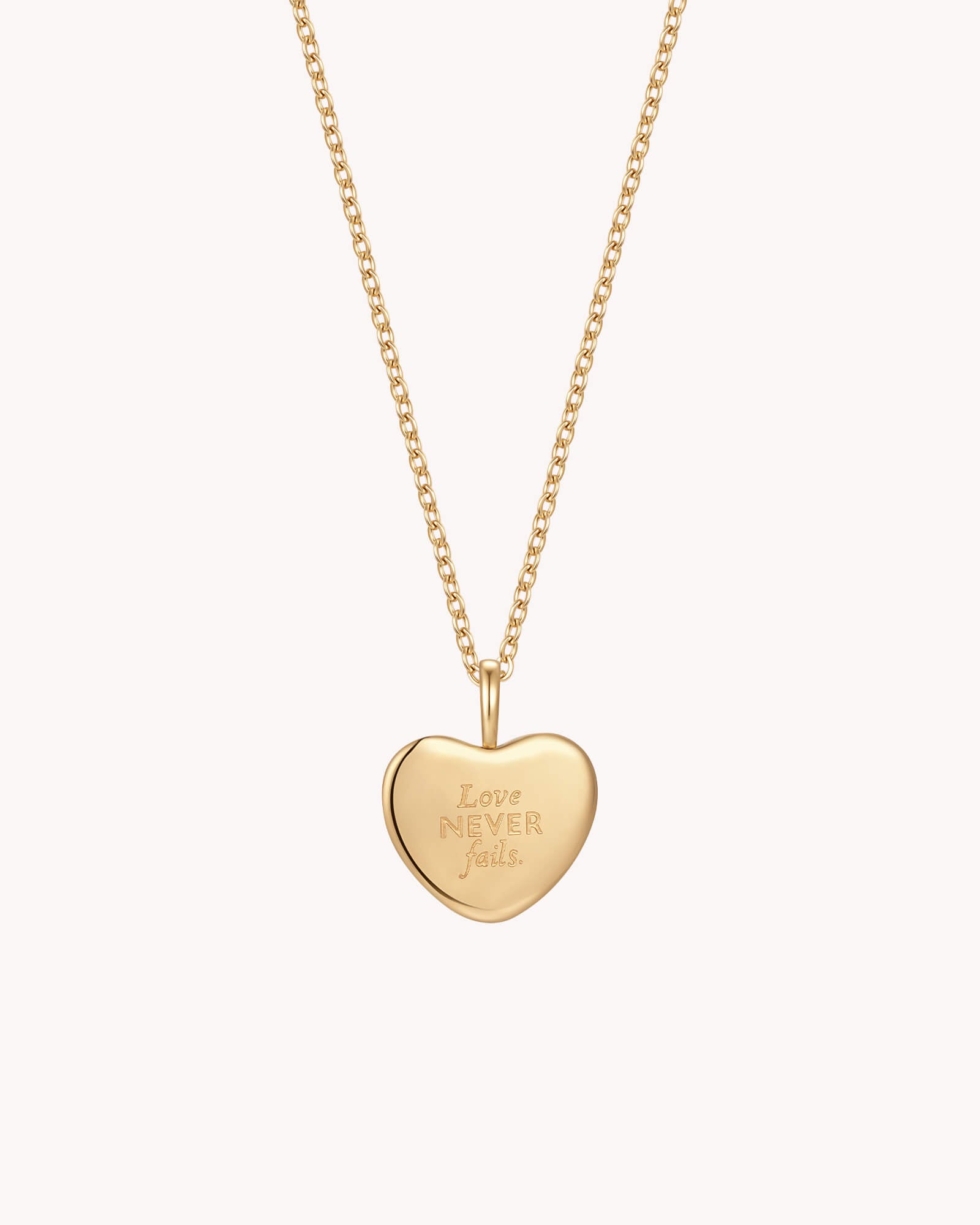 Back of 1 Corinthians 13:8 Love Never Fails Gold Heart Necklace