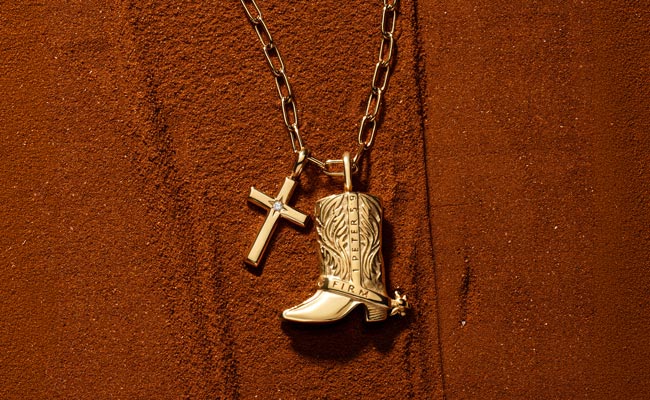Cowboy Boots Pendant inspired by 1 Peter 5:9 on deep red sand