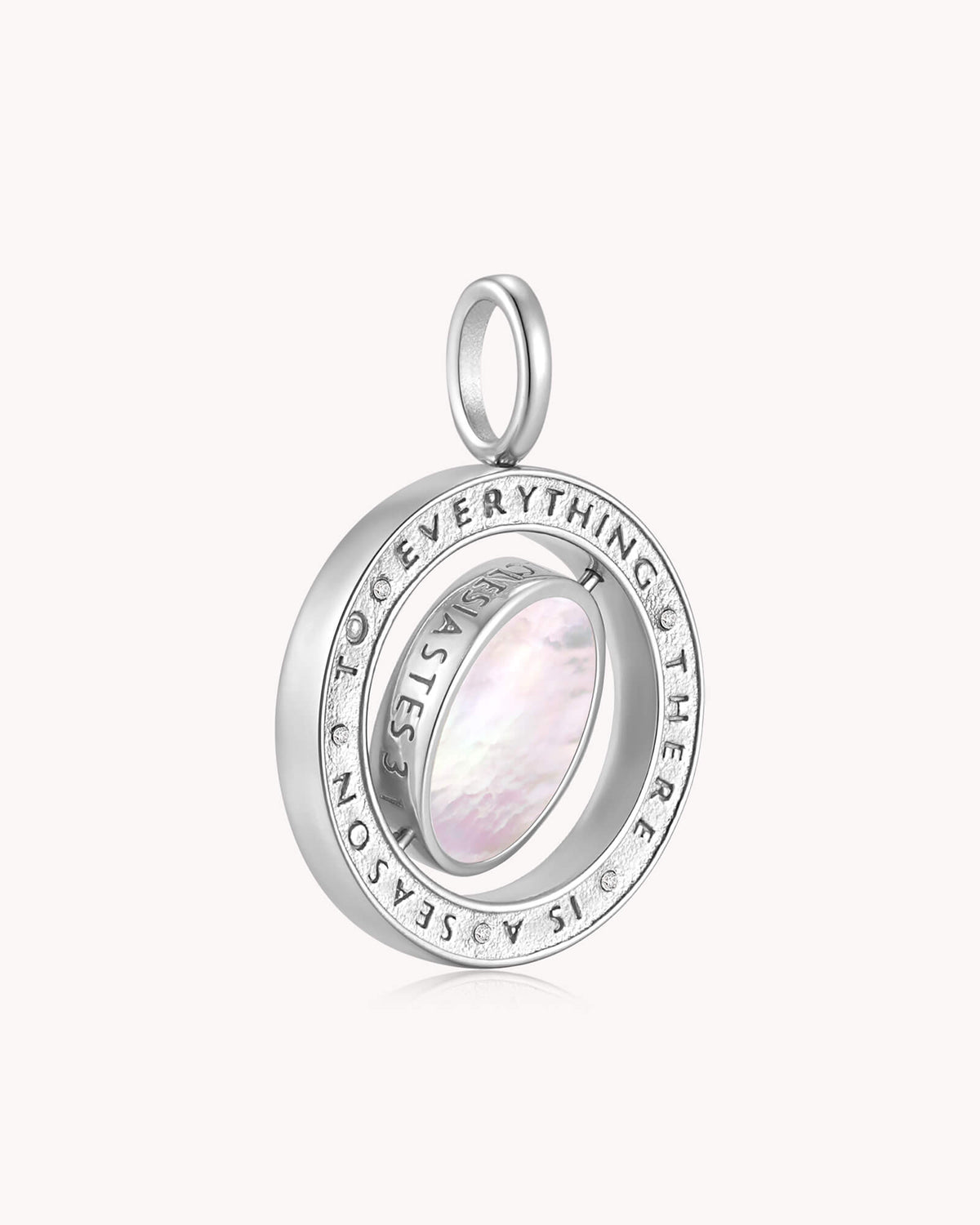 Angled view of To Everything There is a Season Ecclesiastes 3:1 White Gold Spinning Medallion