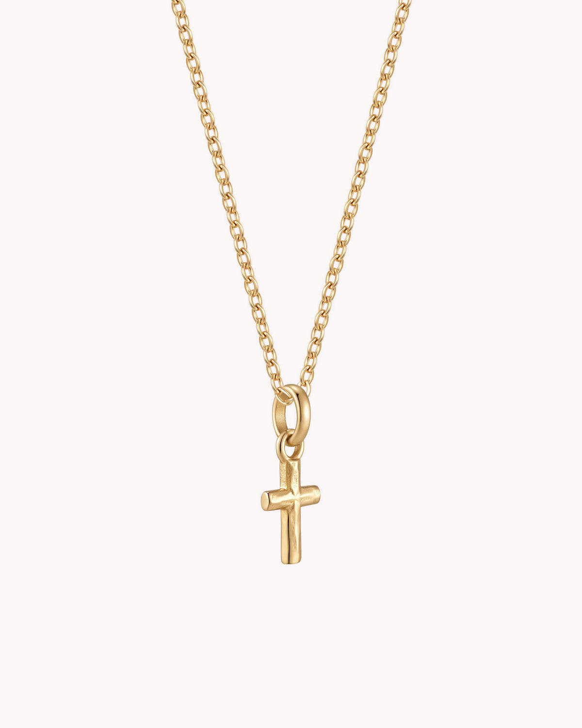 Angled view of Gold Petite Textured Cross Cable Chain Necklace
