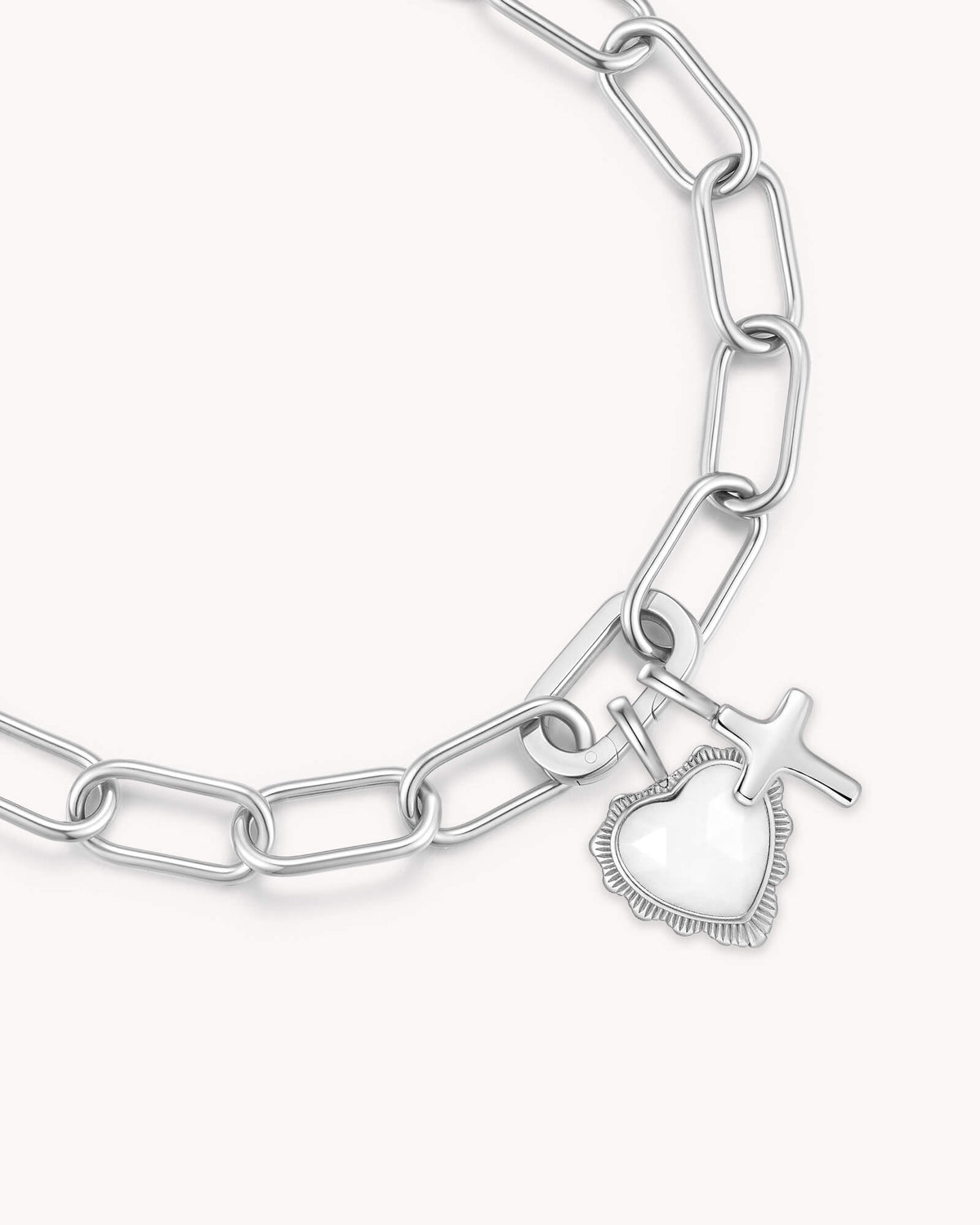 Close up of John 16:33 White Gold Heart Puff Cross Charm Bracelet