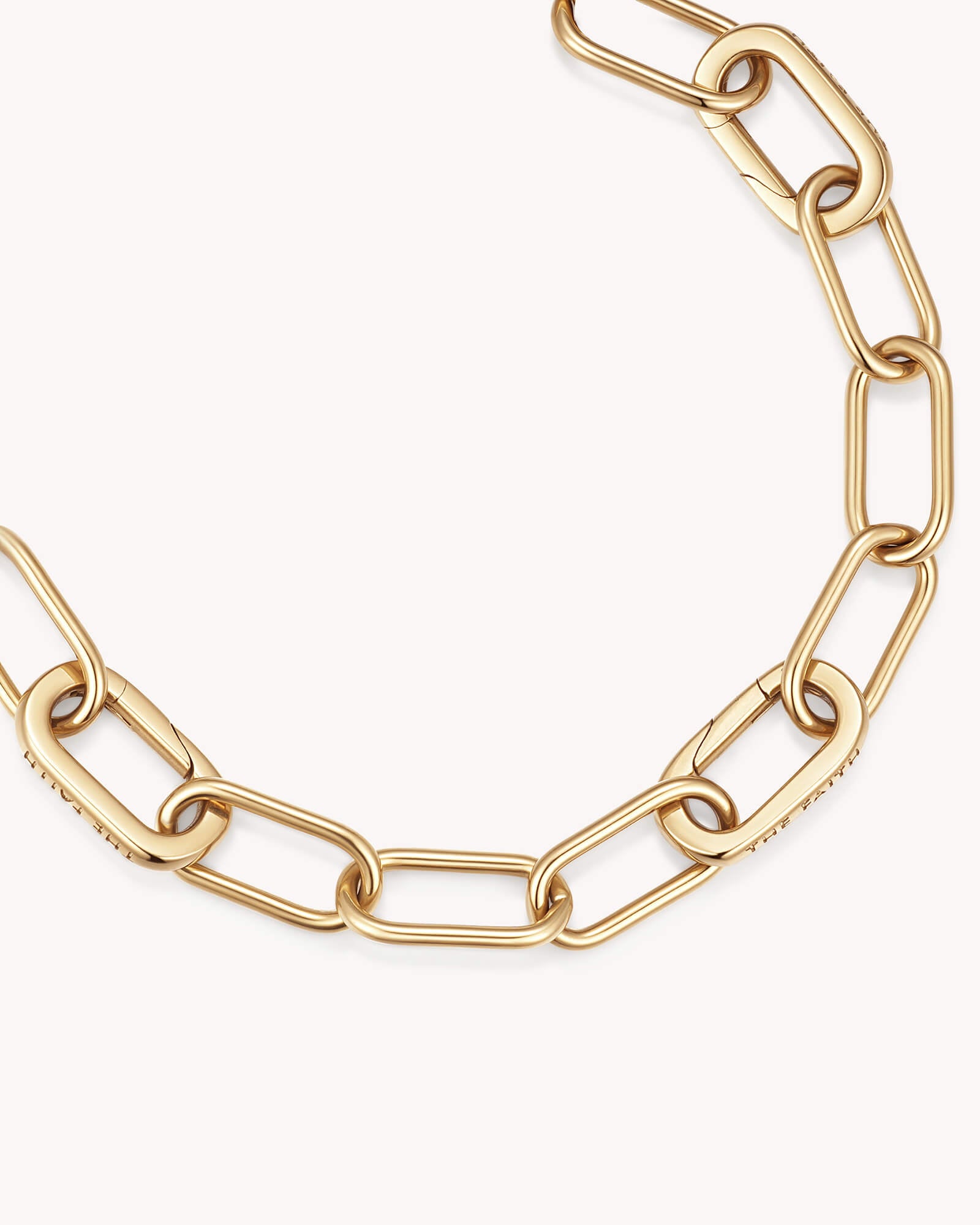 Close-up of Large Link Chain Gold Bracelet with Three Annex Links
