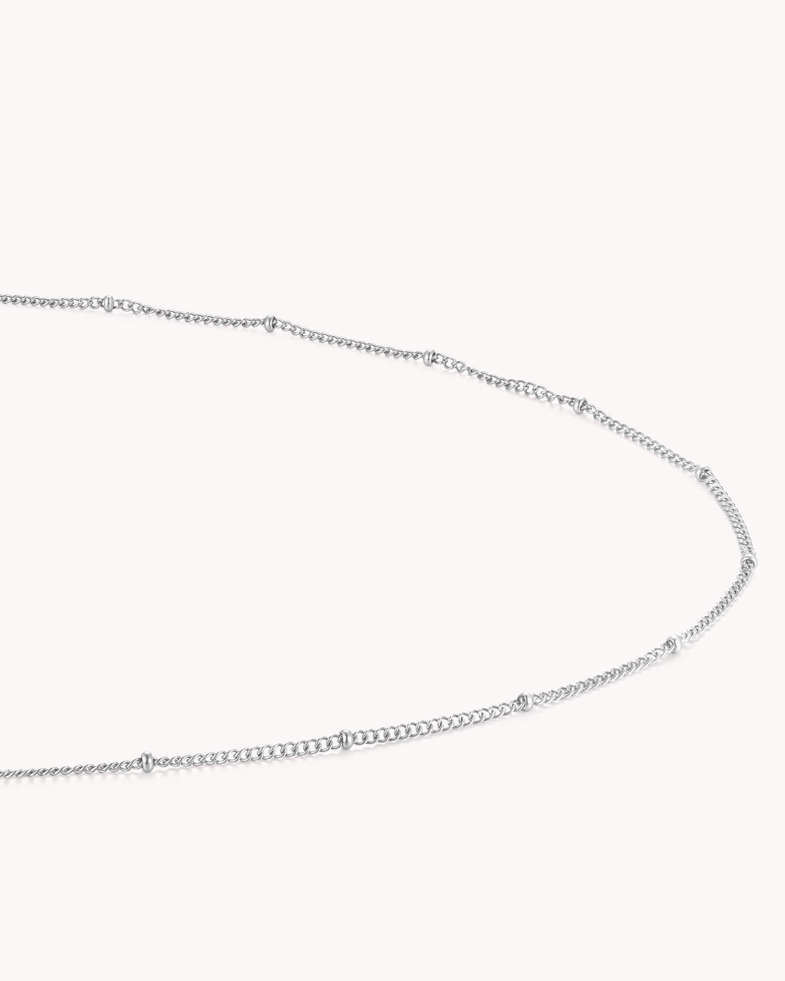 Angled view of Satellite Chain White Gold Necklace
